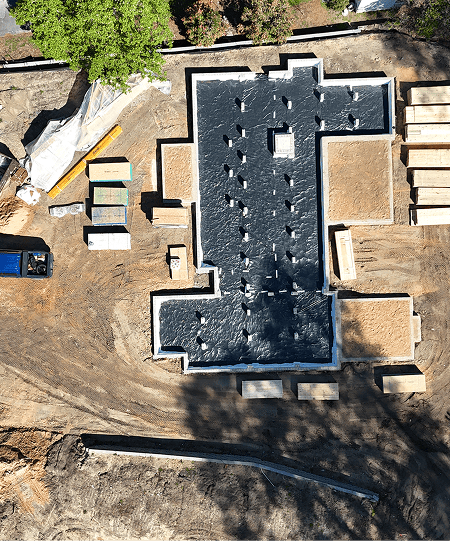 Aerial view of Heathwood custom home's foundation under construction.