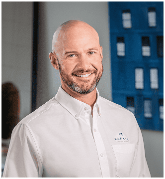 Lucas Bunch, Lafaye Custom Homes team member, smiling in professional attire.