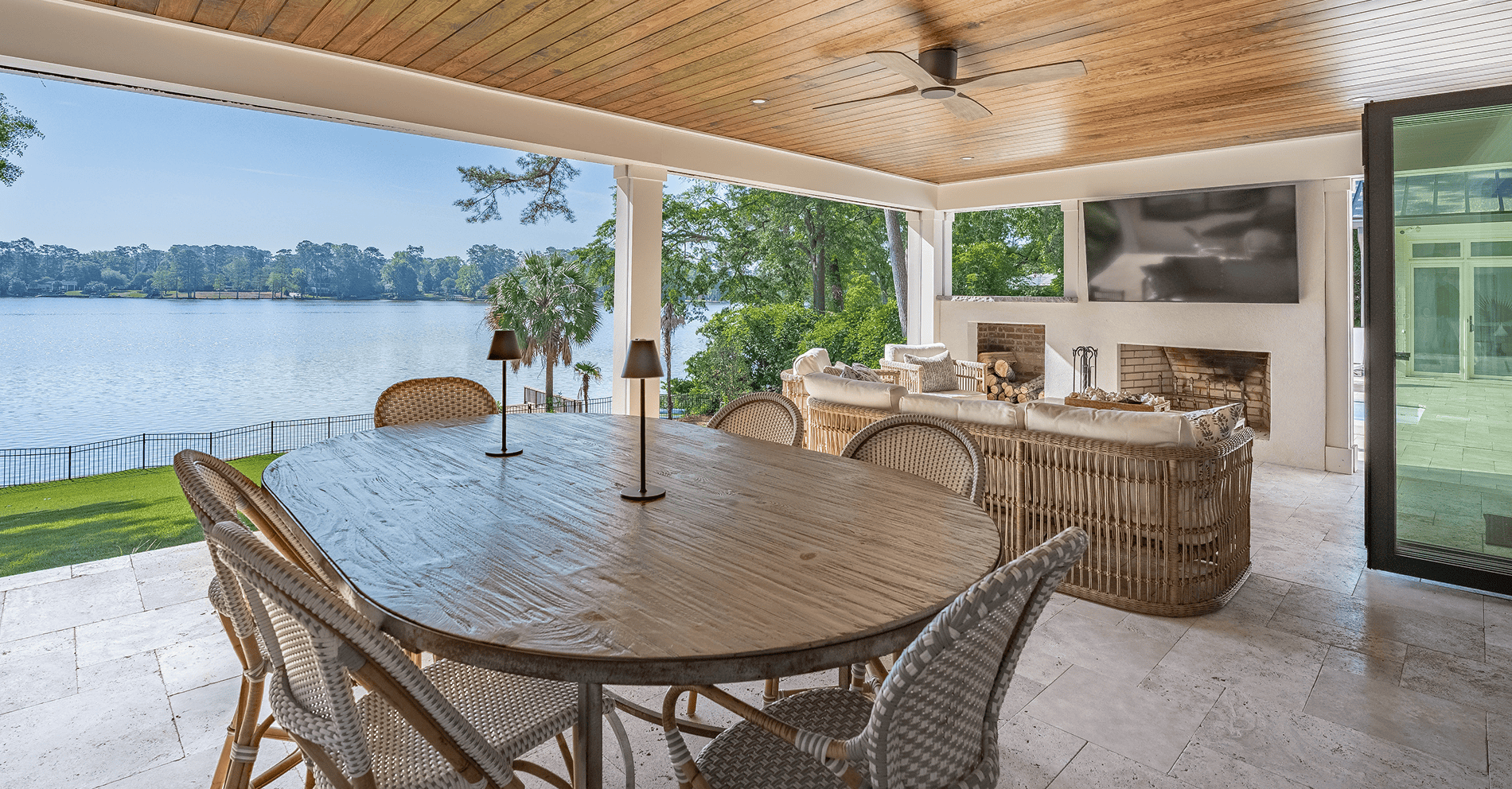 Beautiful lakeside living room in a custom Lafaye home with spacious seating and scenic water views.